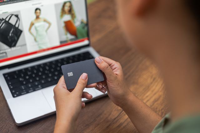 Shopping online with a card in hand