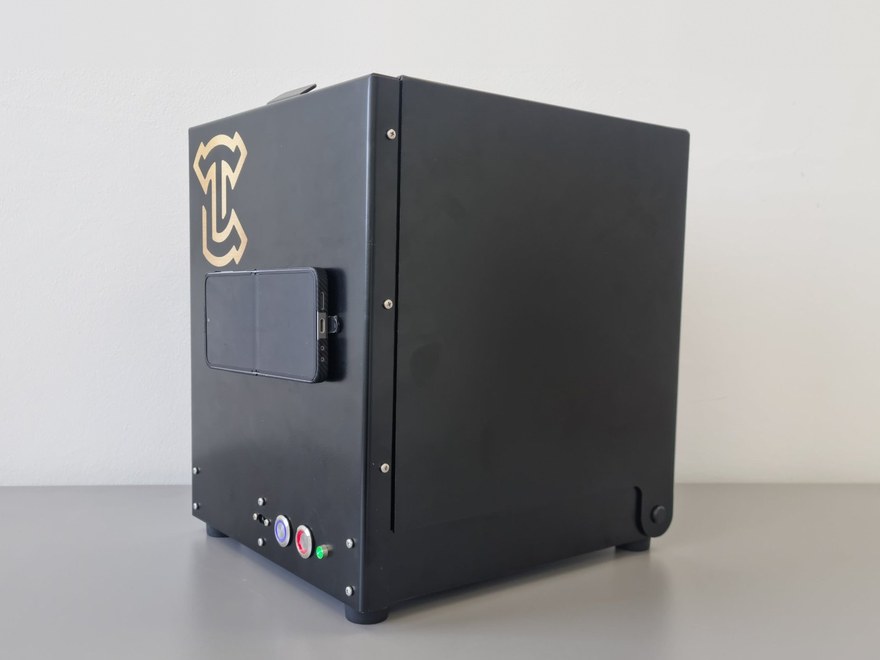 The TruBox capture station: a matt black enclosure with the phone mount on the front panel